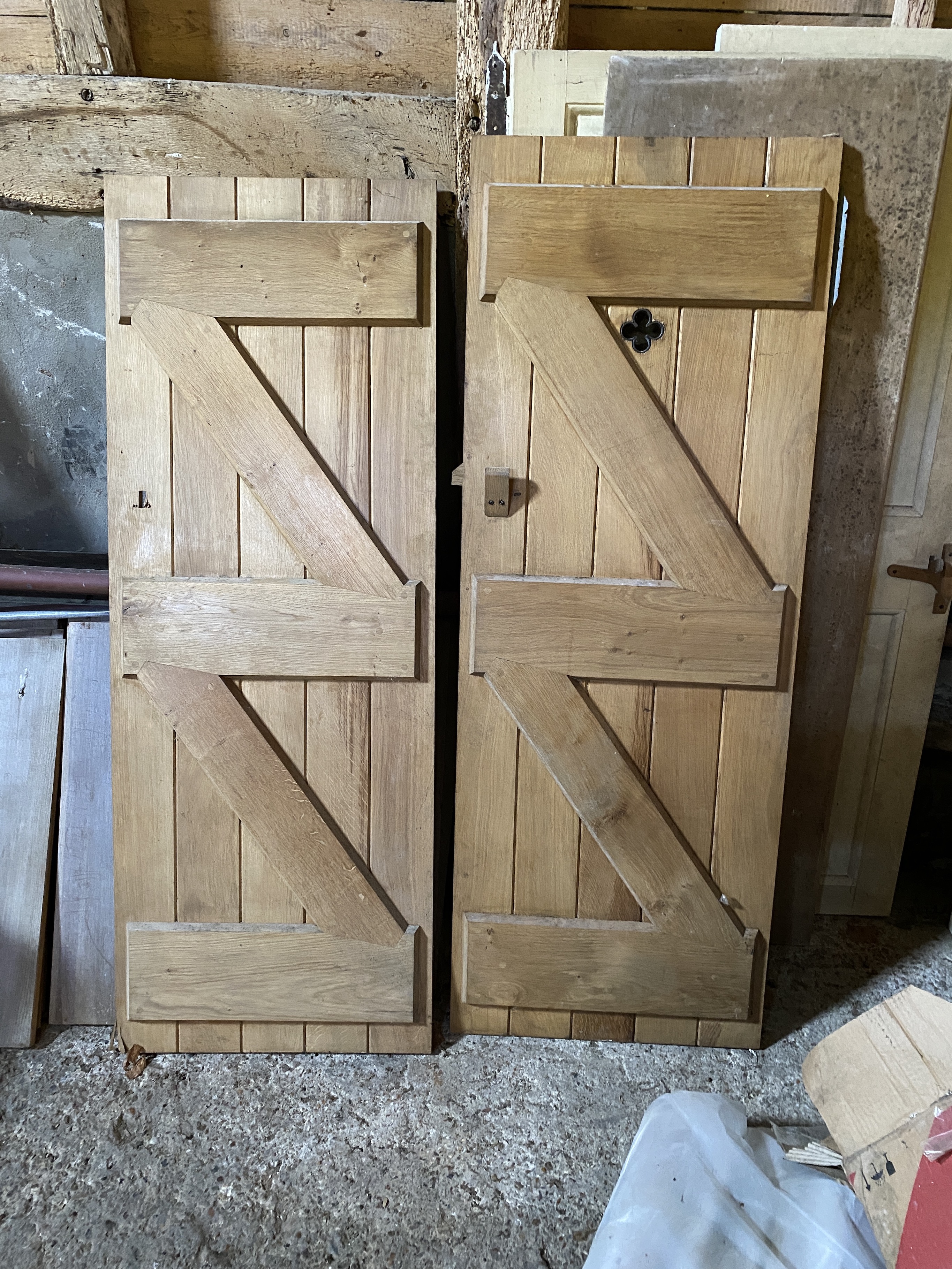 Four panelled solid oak doors, 210 x 86.5cm; 200 x 62.5cm; 171 x 63.5cm and 72 x 63.5cm